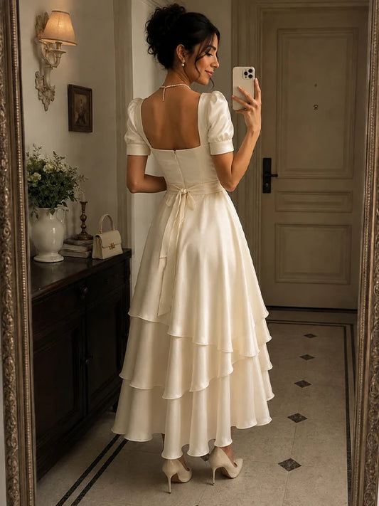 Robe de soirée midi trapèze élégante en satin ivoire à encolure carrée et manches courtes bouffantes étagées DP8664
