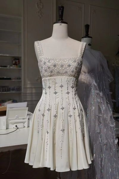 Superbe robe de soirée courte blanche à bretelles et perles, DP4890