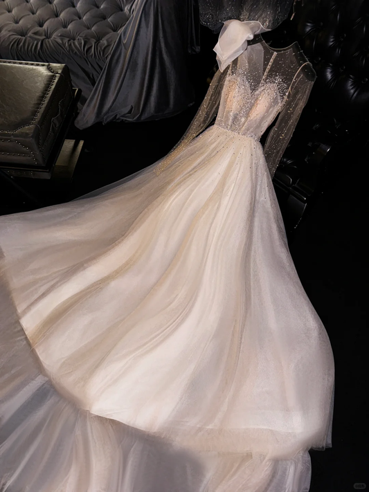 Robe de mariée glamour et vaporeuse en tulle champagne, corsage transparent orné de perles DP7321