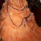 Glamorous Orange Off-the-Shoulder Beaded Ruffled Tulle Ball Gown DP8350