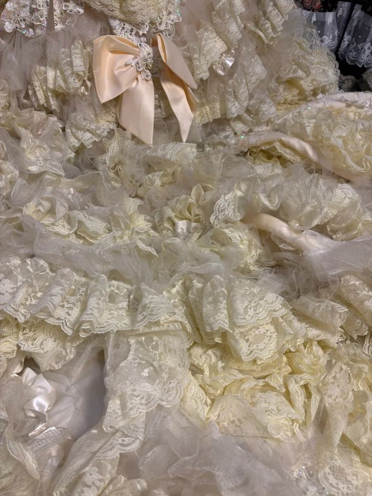 Vintage-Inspired Ivory Lace Ball Gown with Ruffled Details & Satin Bow Accents DP7008