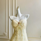 Vintage elfenbeinfarbenes, trägerloses A-Linien-Tüll-Ballkleid mit Perlen DP8404