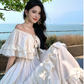 Vintage Elfenbein trägerloses Rüschensaum-Design Elegantes Strandurlaubs-Sommerkleid in A-Linie DP6264