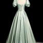 Robe de soirée glamour vert sauge, coupe trapèze, manches bouffantes et nœud, en satin DP7090