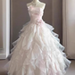 Robe de bal de quinceañera glamour rose clair à volants en organza, sans bretelles, coupe trapèze, ornée de fleurs 3D DP7093
