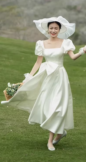 Robe de mariée vintage en satin ivoire, longueur thé, manches bouffantes, nœud surdimensionné DP7682
