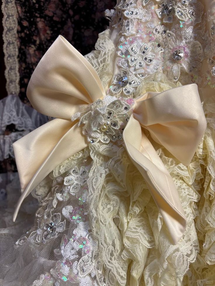 Vintage-Inspired Ivory Lace Ball Gown with Ruffled Details & Satin Bow Accents DP7008