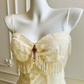 Vintage elfenbeinfarbenes, trägerloses A-Linien-Tüll-Ballkleid mit Perlen DP8404