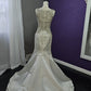Robe de mariée sirène de luxe en satin ornée de perles avec décolleté illusion DP8426